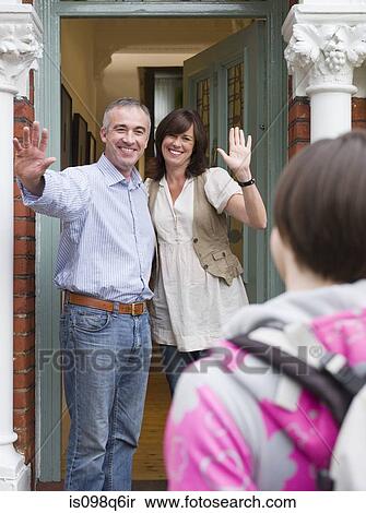 Stock Photography - Parents greeting their daughter. Fotosearch