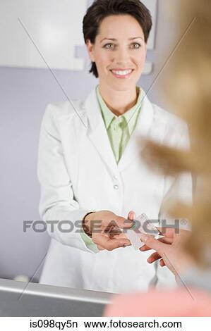 Paying for dental treatment View Large Photo Image Picture - Paying for dental treatment. Fotosearch