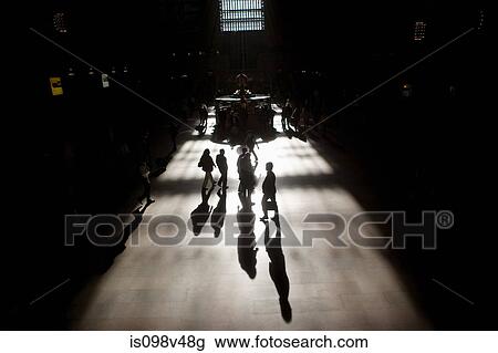 Stock Image - People in train station, silhouette. Fotosearch