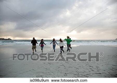 People running on beach View Large Photo Image Picture - People running on beach. Fotosearch