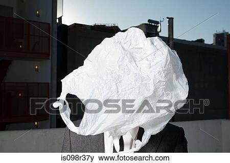 Stock Photo - Plastic bag covering businessman's face. Fotosearch
