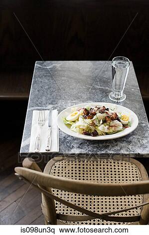 Stock Photography - Plate of salad in cafe. Fotosearch