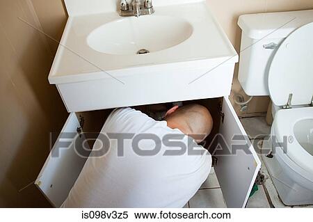 Plumber repairing sink View Large Photo Image Stock Photography - Plumber repairing sink. Fotosearch