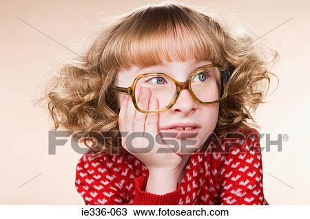 Stock Image - Portrait of a bored geeky girl. Fotosearch