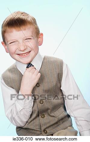 Stock Image - Portrait of a boy laughing. Fotosearch