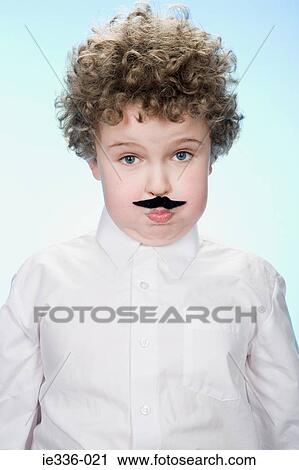 Portrait of a boy wearing a fake moustache View Large Photo Image Stock Image - Portrait of a boy wearing a fake moustache. Fotosearch