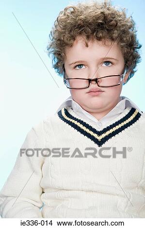 Picture - Portrait of a boy wearing eyeglasses. Fotosearch