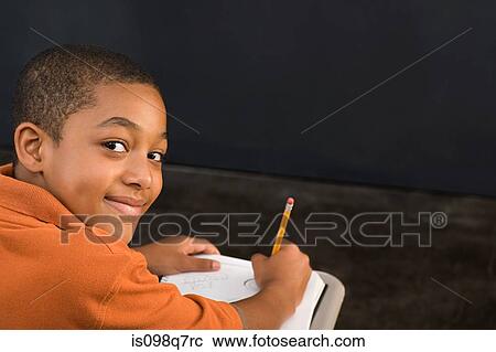 Portrait of a boy writing View Large Photo Image Stock Image - Portrait of a boy writing. Fotosearch