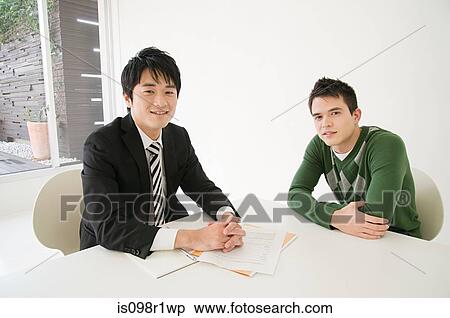 Stock Photography - Portrait of a businessman and a client. Fotosearch