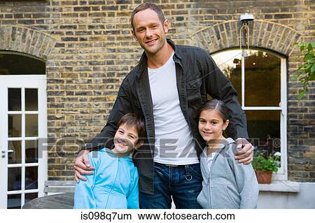 Portrait of a father and his children View Large Photo Image Picture - Portrait of a father and his children. Fotosearch