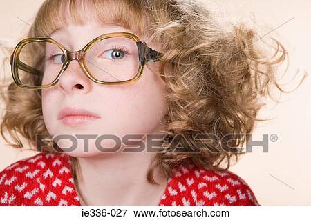 Stock Photo - Portrait of a geeky girl. Fotosearch
