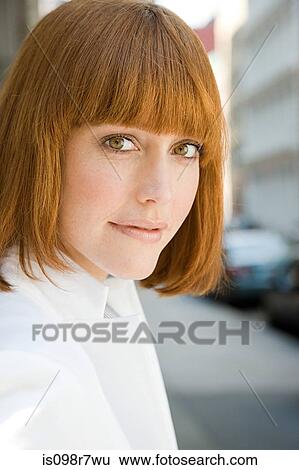 Stock Photograph - Portrait of a ginger haired woman. Fotosearch