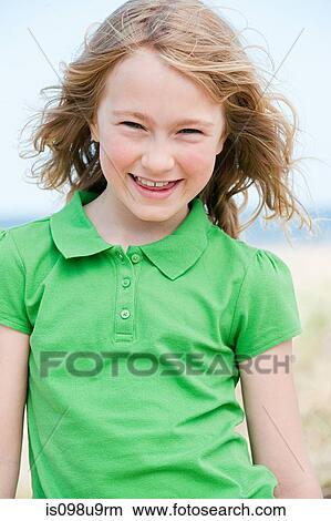 Picture - Portrait of a girl at the coast. Fotosearch