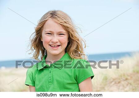 Portrait of a girl at the coast View Large Photo Image Picture - Portrait of a girl at the coast. Fotosearch