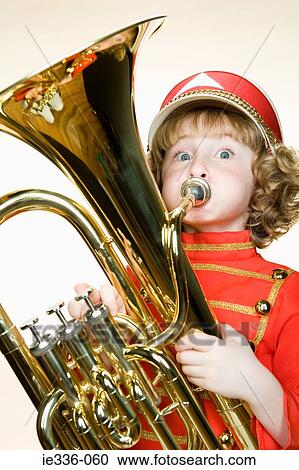 Portrait of a girl playing the tuba View Large Photo Image Stock Image - Portrait of a girl playing the tuba. Fotosearch