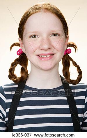 Portrait of a girl with pigtails View Large Photo Image Stock Photo - Portrait of a girl with pigtails. Fotosearch
