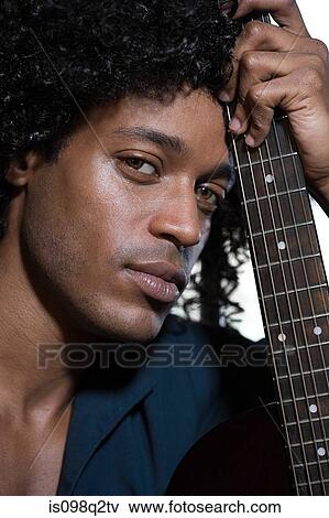 Portrait of a guitarist View Large Photo Image Stock Photo - Portrait of a guitarist. Fotosearch