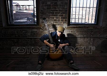 Portrait of a guitarist View Large Photo Image Stock Photo - Portrait of a guitarist. Fotosearch
