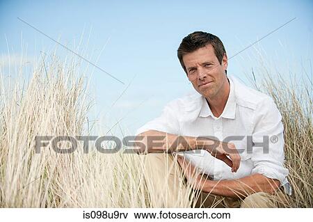 Portrait of a man at the coast View Large Photo Image Stock Photo - Portrait of a man at the coast. Fotosearch