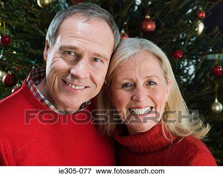 Stock Photo - Portrait of a mature couple at christmas. Fotosearch