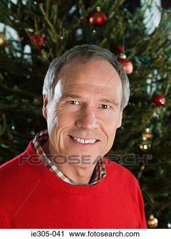 Portrait of a mature man at christmas View Large Photo Image Stock Image - Portrait of a mature man at christmas. Fotosearch