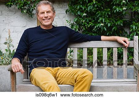 Portrait of a senior man sat on a bench View Large Photo Image Stock Image - Portrait of a senior man sat on a bench. Fotosearch