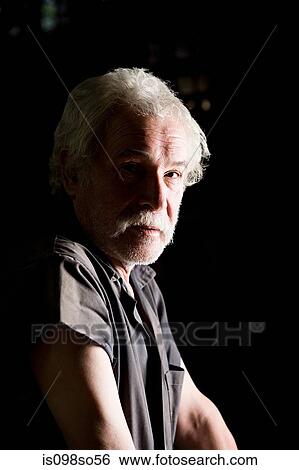 Portrait of a senior man with shadow and light View Large Photo Image Stock Photograph - Portrait of a senior man with shadow and light. Fotosearch
