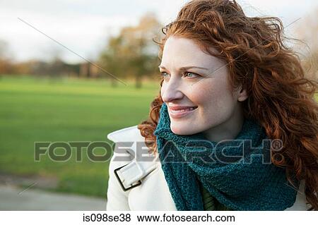 Portrait of a smiling red haired woman View Large Photo Image Stock Photo - Portrait of a smiling red haired woman. Fotosearch