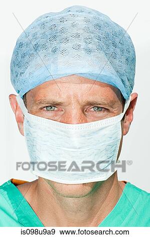 Stock Photo - Portrait of a surgeon in mask. Fotosearch