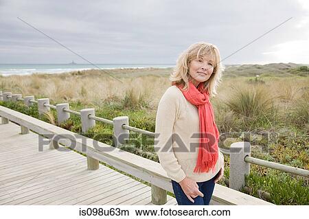 Portrait of a woman at the coast View Large Photo Image Picture - Portrait of a woman at the coast. Fotosearch