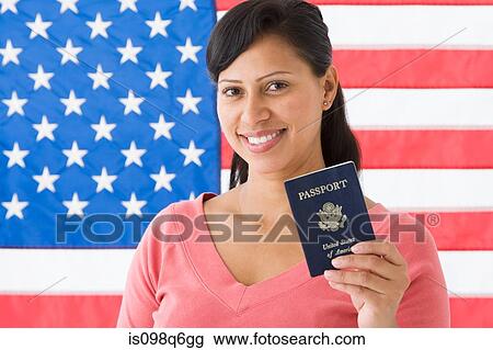 Portrait of a woman holding a passport View Large Photo Image Stock Image - Portrait of a woman holding a passport. Fotosearch