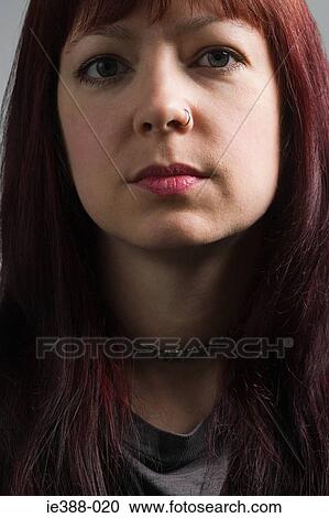 Stock Image - Portrait of a woman with nose ring. Fotosearch