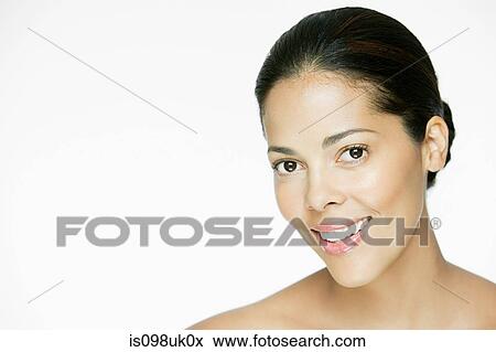 Stock Photo - Portrait of a young hispanic woman. Fotosearch