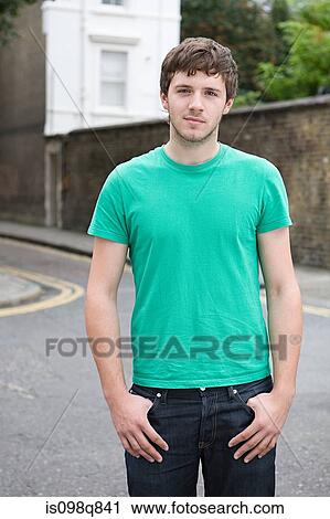 Stock Image - Portrait of a young man in street. Fotosearch