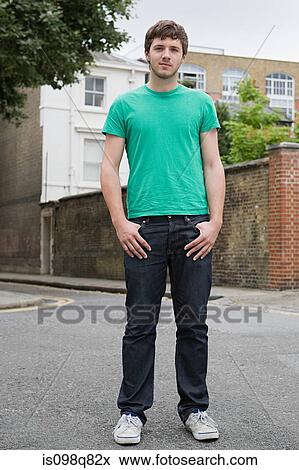 Stock Photo - Portrait of a young man in street. Fotosearch