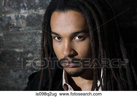 Portrait of a young man with dreadlocks View Large Photo Image Stock Image - Portrait of a young man with dreadlocks. Fotosearch