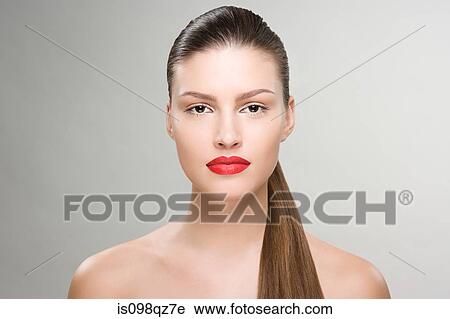 Portrait of a young woman wearing lipstick View Large Photo Image Stock Image - Portrait of a young woman wearing lipstick. Fotosearch