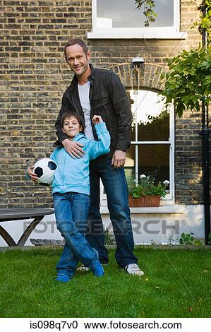 Stock Image - Portrait of father and son. Fotosearch