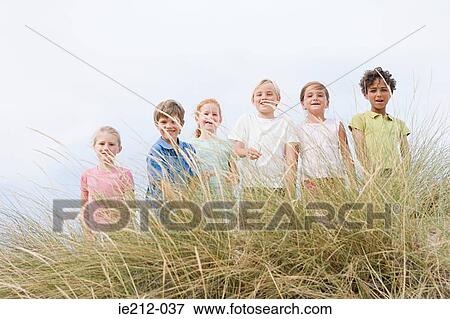 Stock Photo - Portrait of friends in a row. Fotosearch