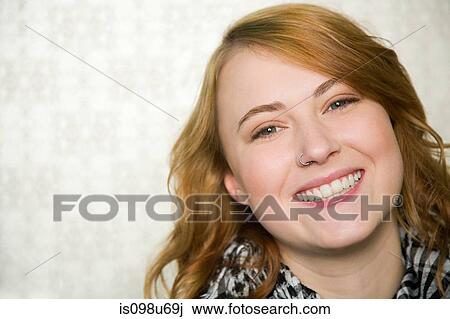 Stock Image - Portrait of teenage girl smiling. Fotosearch