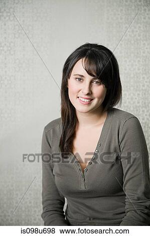 Stock Photo - Portrait of teenage girl wearing gray top. Fotosearch