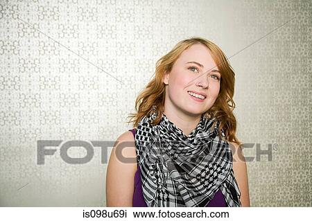 Portrait of teenage girl wearing checked scarf View Large Photo Image Stock Image - Portrait of teenage girl wearing checked scarf. Fotosearch