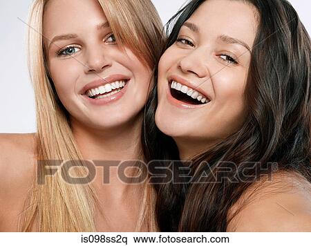 Portrait of two young women side by side View Large Photo Image Stock Photography - Portrait of two young women side by side. Fotosearch