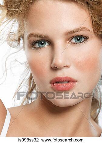 Stock Image - Portrait of young blonde woman. Fotosearch