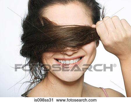 Stock Image - Portrait of young brunette woman. Fotosearch