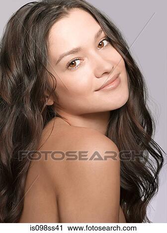 Stock Image - Portrait of young brunette woman. Fotosearch