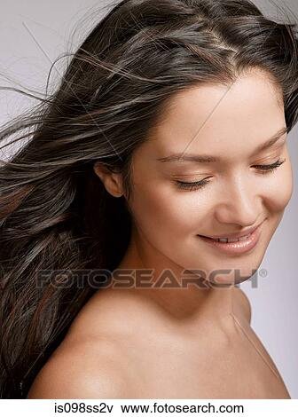 Stock Photo - Portrait of young brunette woman. Fotosearch