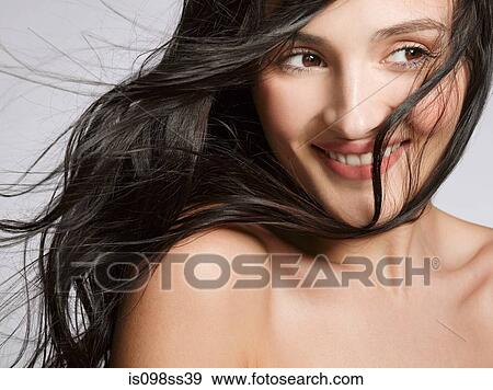 Stock Photo - Portrait of young brunette woman. Fotosearch
