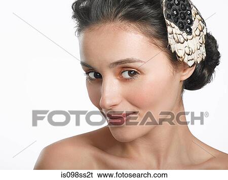 Stock Photograph - Portrait of young brunette woman. Fotosearch
