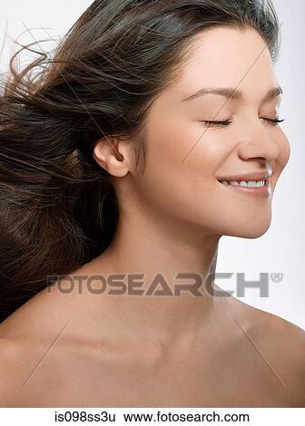Stock Photograph - Portrait of young brunette woman. Fotosearch